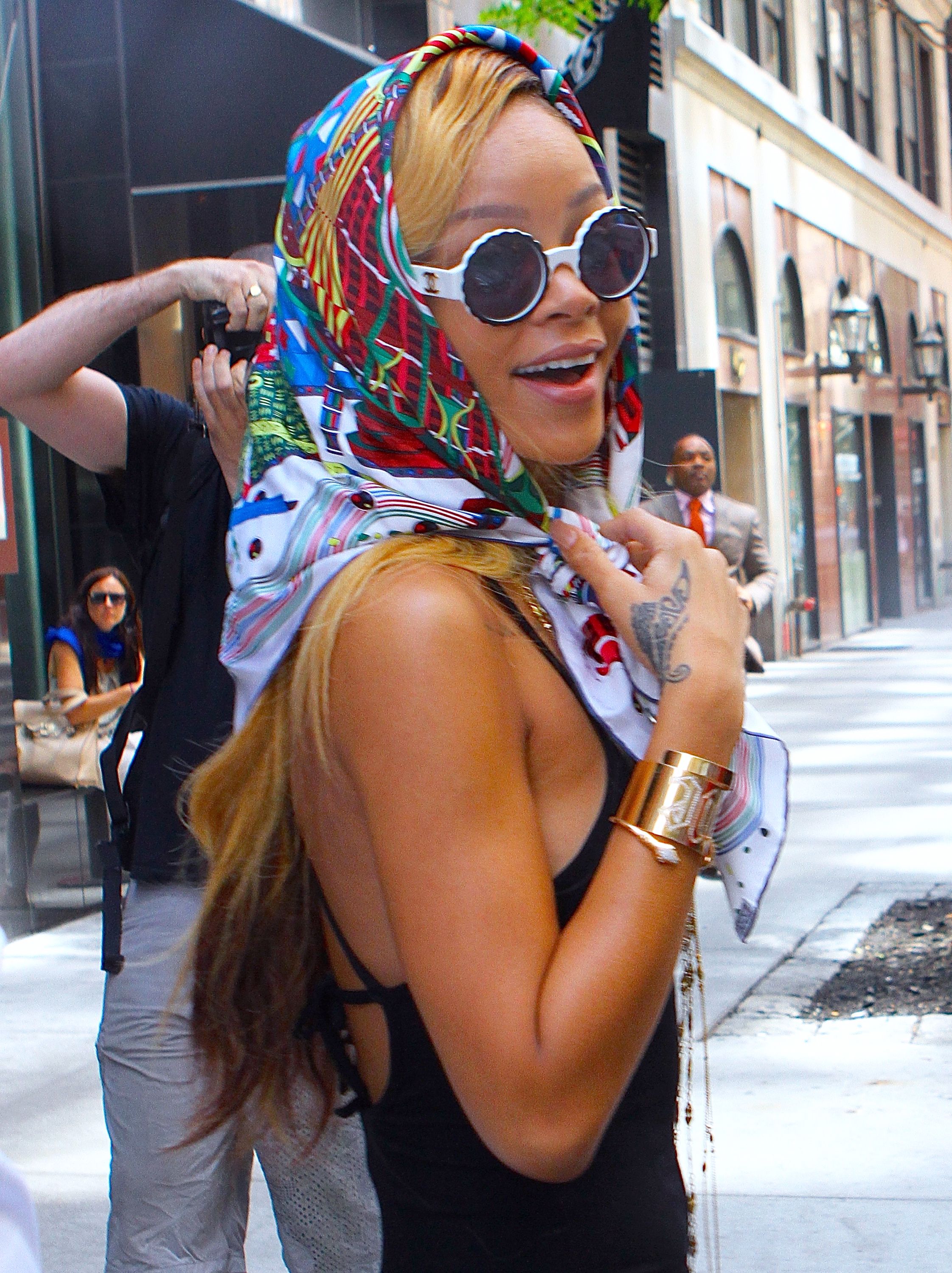 Rihanna wears a colorful scarf over her head as she leaves her hotel Rihanna wears a colorful scarf over her head as she leaves her hotel