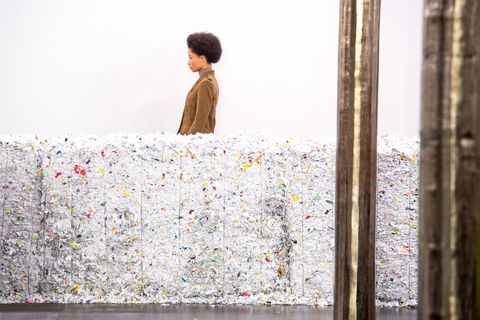 a model walks among reclaimed fabric at hearst’s fall 2020 show